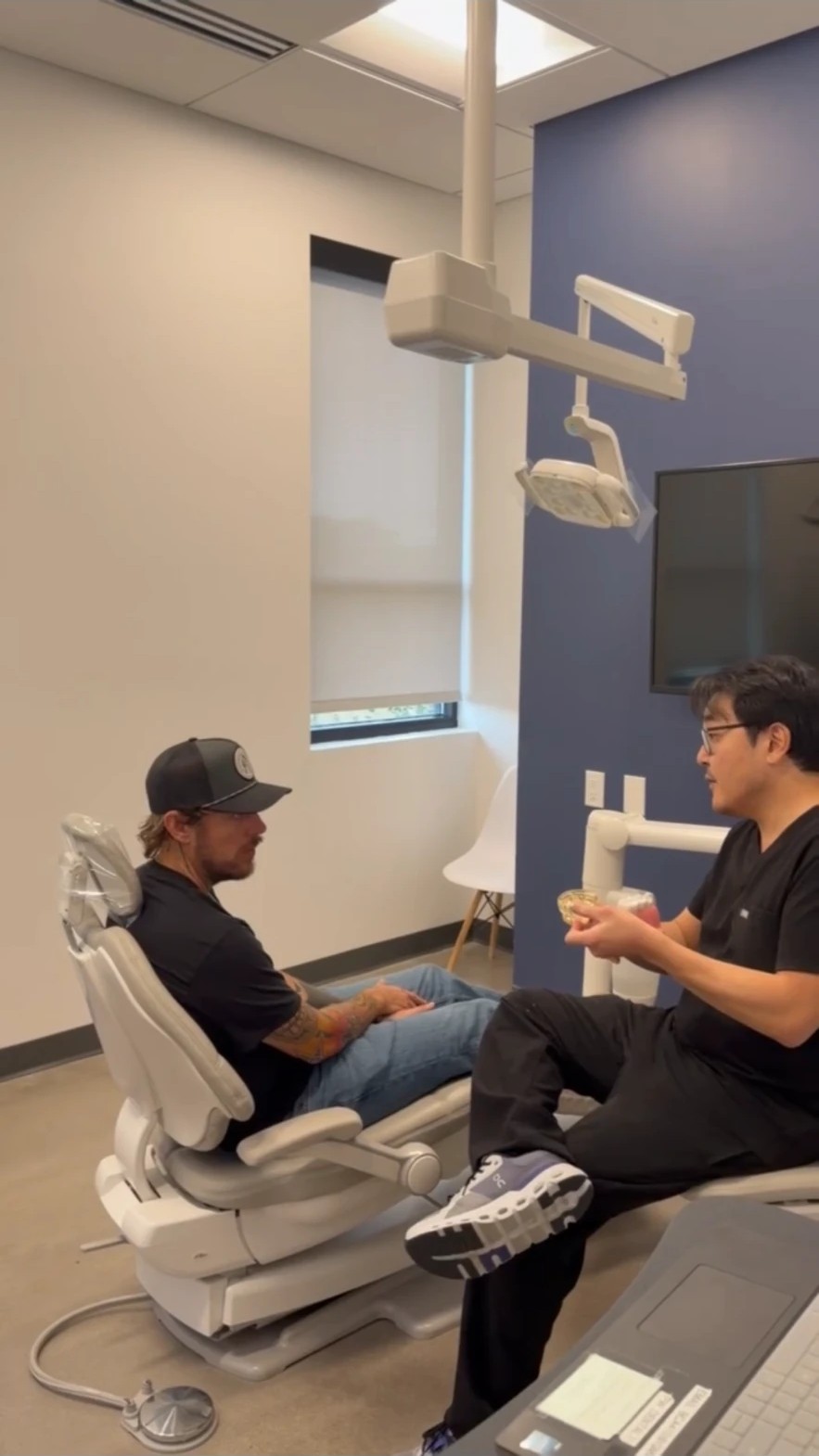 A prosthodontist discussing tooth replacement options with a patient at Restorative Dentistry Group.